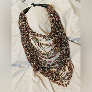 Multi-strand multi-colored beaded necklace.